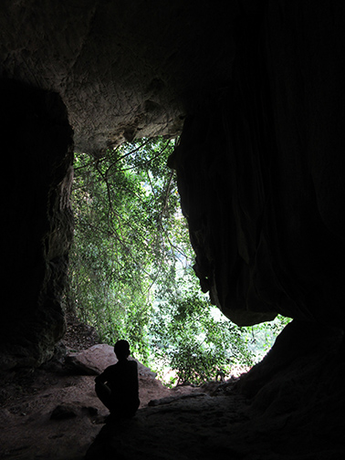 Cave in Laos photograph by Mark Ulyseas